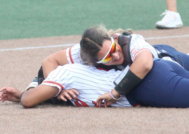 Oswego catcher Kiyah Chavez hugs pitcher Jaelyn Anthony after defeating Mundelein during the Class 4A third place game on Saturday, June 8, 2024 at the Louisville Slugger Sports Complex in Peoria.