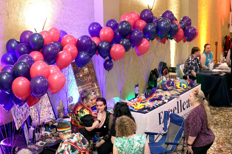 People visit some of the booths inside the Egyptian Theatre Thursday, June 20, 2024, during DeKalb Pride Fest.