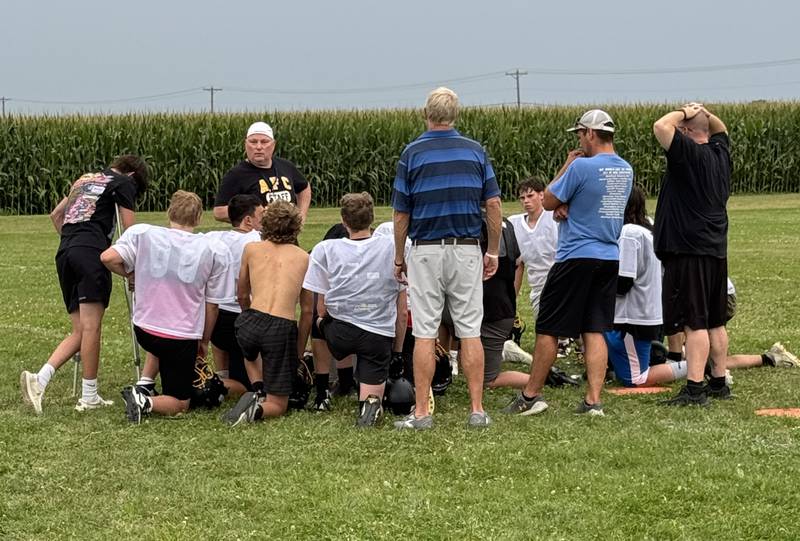 New Ashton-Franklin Center head coach Dave Smith talks to his players after practice on Wednesday, Aug. 14, 2024 in Ashton.