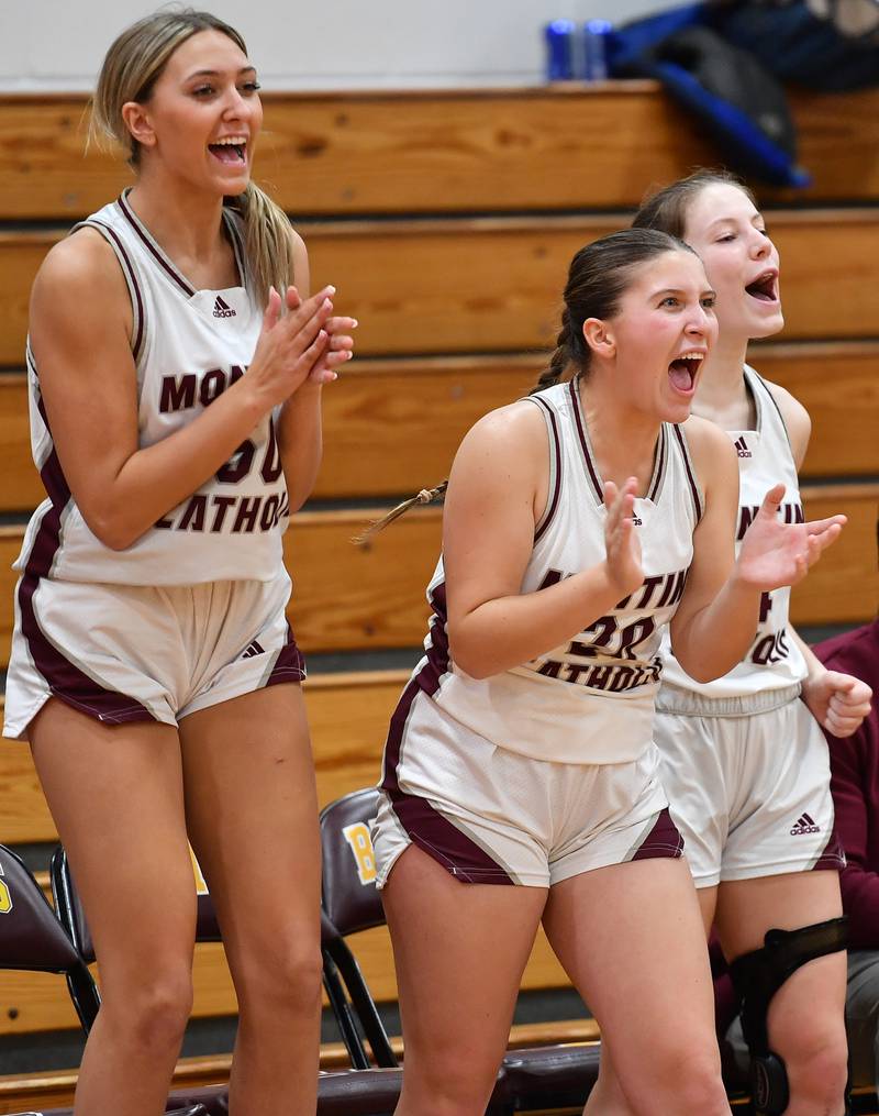 From left, Montini's Lauren Mellish, Lily Spanos, and Riley White cheer on teammates as the final seconds count down in the Montini Christmas Tournament championship against St. Charles East on Dec. 29, 2023 at Montini Catholic High School in Lombard.