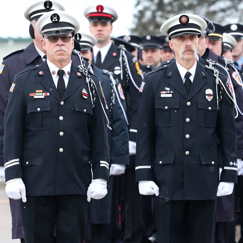 Firefighters from all around the area wait Saturday, Jan. 6, 2024, to file in to the visitation for Sycamore firefighter/paramedic Bradley Belanger at the Sycamore Park District Community Center. Belanger, 45, who worked with the Sycamore Fire Department for more than two decades, died Friday, Dec. 22, after a yearlong battle with cancer.