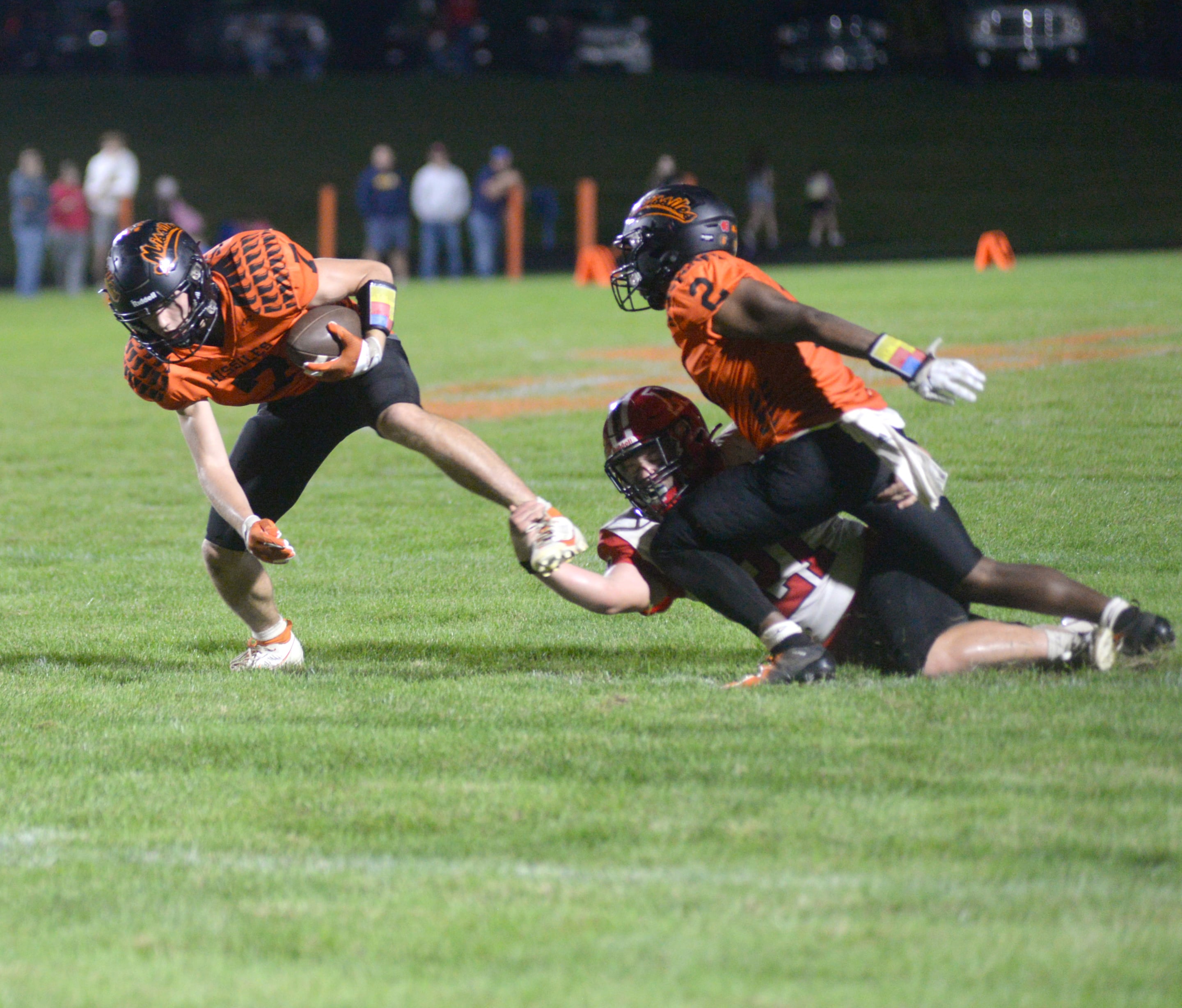 Milledgeville's Konner Johnson (7) fights to break an Amboy tackle on Friday, Sept. 29, 2023 at Milledgeville High School.