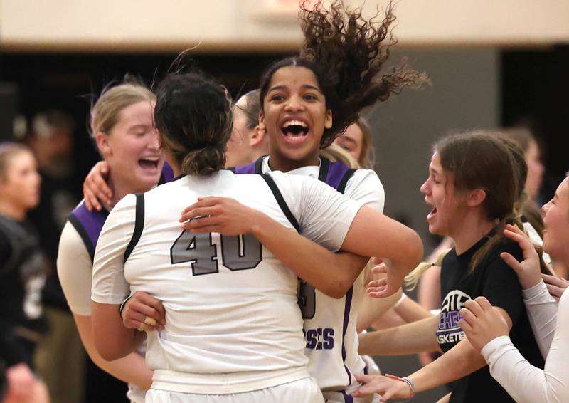 Dixon players celebrate their Class 3A regional championship win over Kaneland Thursday, Feb. 22, 2024, at Sycamore High School.