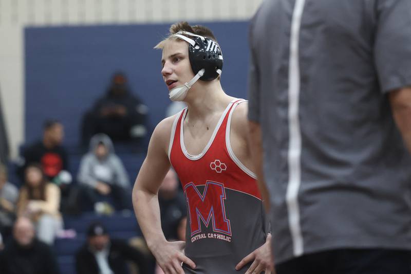 Marian Central’s Jimmy Mastny waits during a break against Eddie Enright of Mt. Carmel in the tri-meet at Joliet Catholic on Thursday, Jan. 18th, 2024 in Joliet.