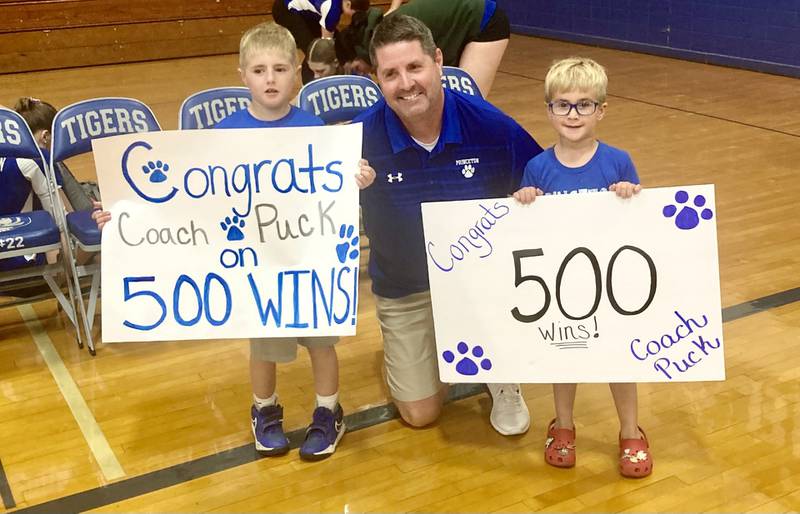 Princeton coach Andy Puck is congratulated on his 500th career victory by young Tigresses fans, Ryne (left) and Reid Chlum.