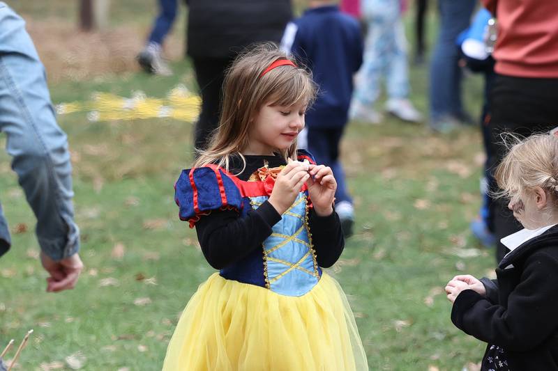 Sophia Hukalowicz eats a S’more at the Hayride of Horrors on Monday, Oct. 14, 2024 at Dellwood Park in Lockport.