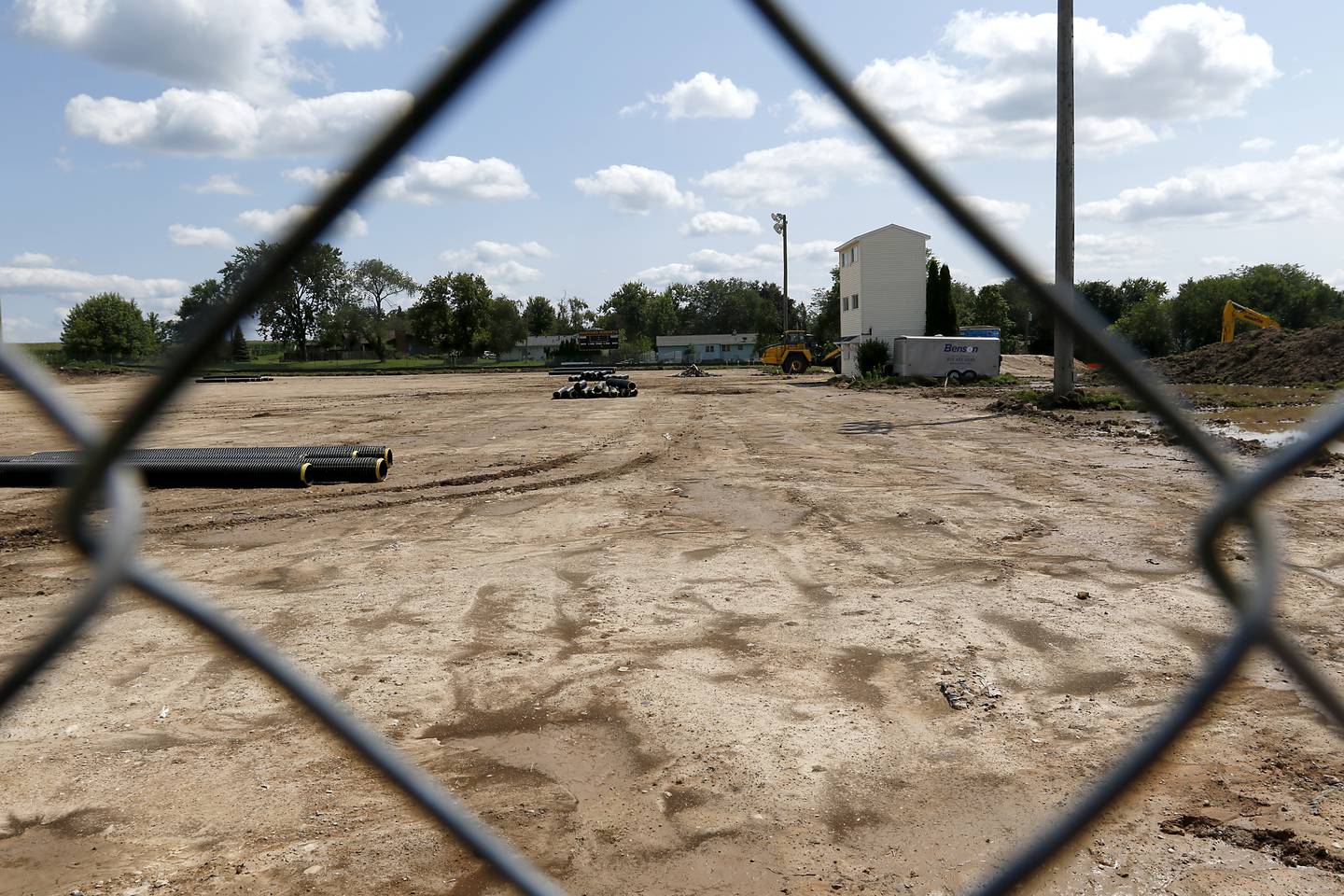 Construction continues on Thursday July 25, 2024 on the new artificial turf field at the Harvard Junior High School.