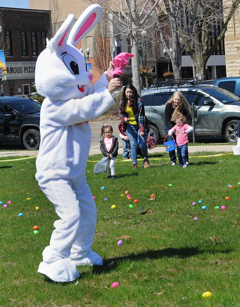 The Easter Bunny signals when to begin the Easter egg hunt Saturday, April 8, 2023, at the Jordan block in Ottawa during an event sponsored and hosted by Floret, Mayor Dan Aussem and the Illinois Valley Contractors Association.