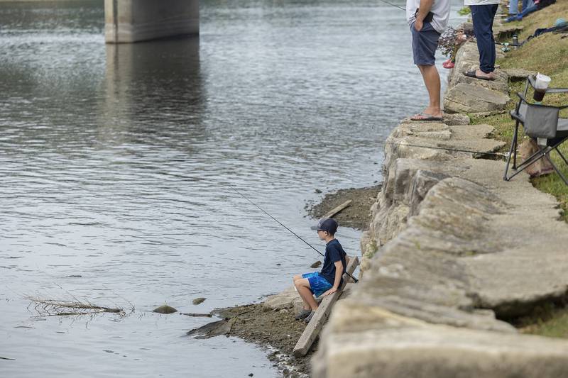 Owen Dempsey, 10, tries his luck closer to the water Saturday, July 1, 2023 for the Elk’s Club Fishing Derby at Petunia Fest.