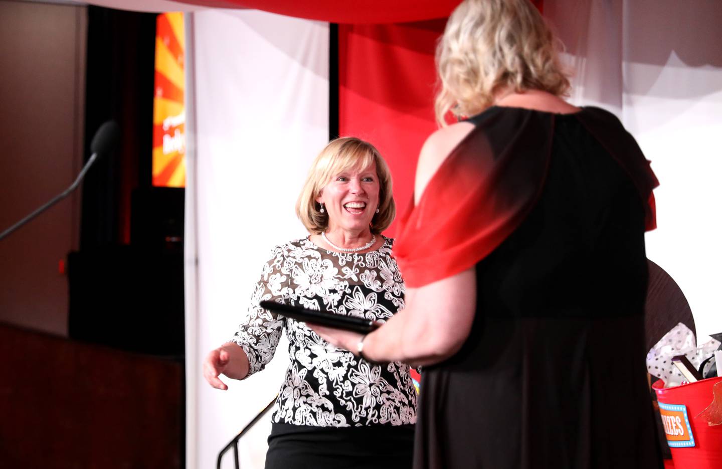 Becky Gillam (left) accepts the 2024 L.E.A.P. Award from St. Charles Chamber of Commerce Executive Director Deborah Gurley during the 56th Annual Charlemagne Awards Dinner at the Q Center in St. Charles on Friday, May 17, 2024.