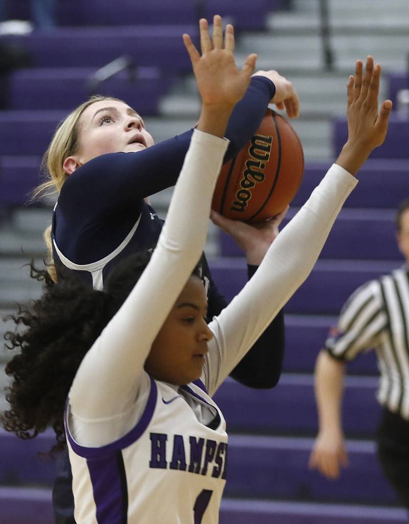 Cary-Grove's Malaina Kurth shoots the ball over Hampshire's Ginger Younger during a Fox Valley Conference girls basketball game Friday, Jan. 26, 2024, at Hampshire High School.