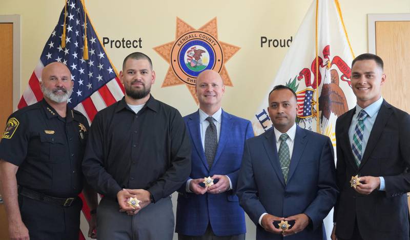 Pictured from left are Kendall County Sheriff Dwight Baird with new deputies Robert Chavez, Brian Evans, Efren Casas, Jr. and David Friedman.