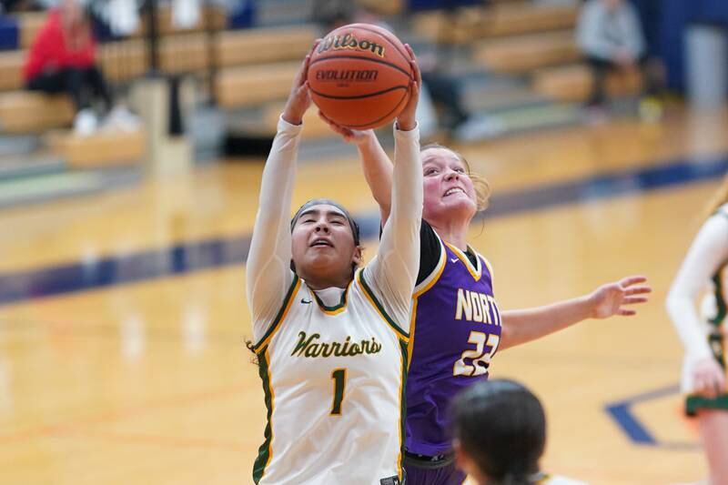 Waubonsie Valley's Arianna Garcia (1) rebounds the ball against Downers Grove North during a Oswego semifinal sectional 4A basketball game at Oswego High School on Tuesday, Feb 20, 2024.