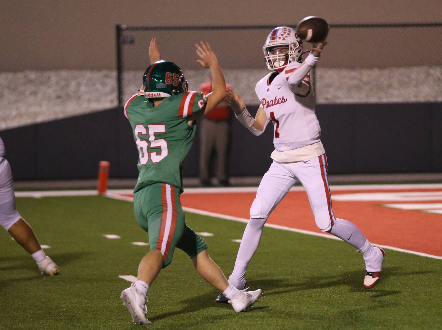 Ottawa quarterback Mark Munson thows the ball as L-P's  Beau Lawerence defends on Friday, Sept. 13, 2024 at Howard Fellows Stadium.