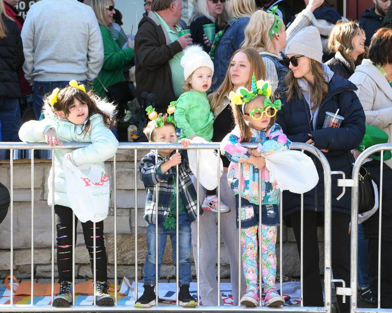 Addison Smolen, 6, of Lockport, Easton Latz, 3, Lockport, Addie Etzkorn, 2 yrs old, Boe Bromberek, of Lemont, Harper Latz, 4, of Lockport and Bella Bromberek of Lemont all wait for the start of the St. Patrick’s Parade in downtown Lemont on Saturday March 9, 2024.