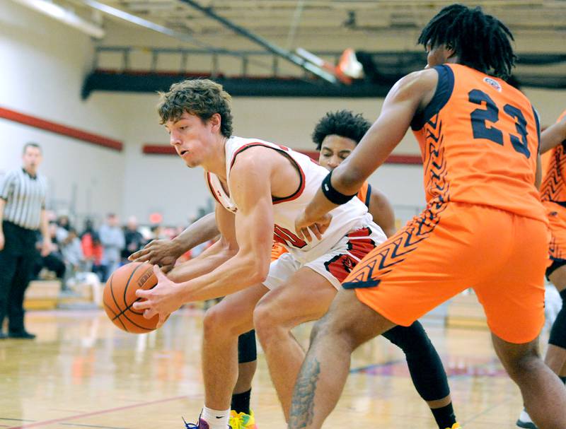 Yorkville's Bryce Salek positions himself for a shot against Romeoville defender D.J. Porter, Jr. (23) during a varsity basketball game at Yorkville High School on Friday, Jan. 19, 2024.