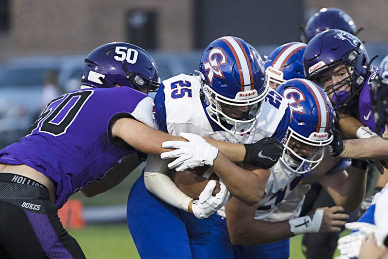 Genoa-Kingston’s Peyton Meyer fights for yards against Dixon’s Aidan Hogard Thursday, Sept. 14, 2023 in a game at Dixon High School.