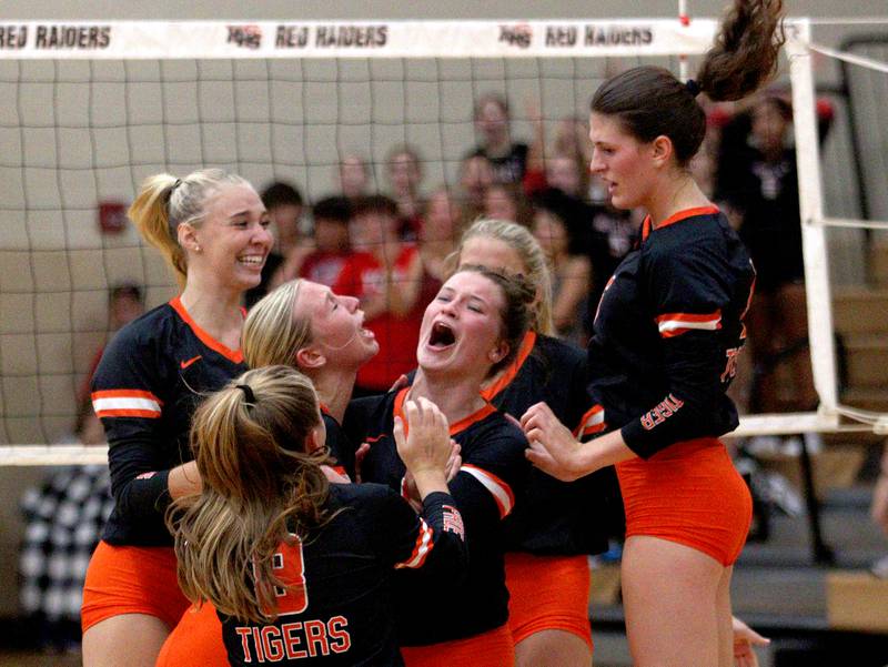 Crystal Lake Central’s Tigers celebrate during their win in a Fox Valley Conference volleyball match on Tuesday, Aug. 27, 2024, at Huntley High School. .