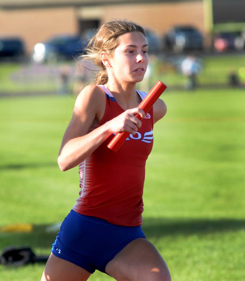 Oregon's Grace Tremble runs with the baton during a leg of the 4x100 relay at the 1A Oregon Sectional on Friday. May 10, 2024. The relay team finished in third place in 51.18 seconds.