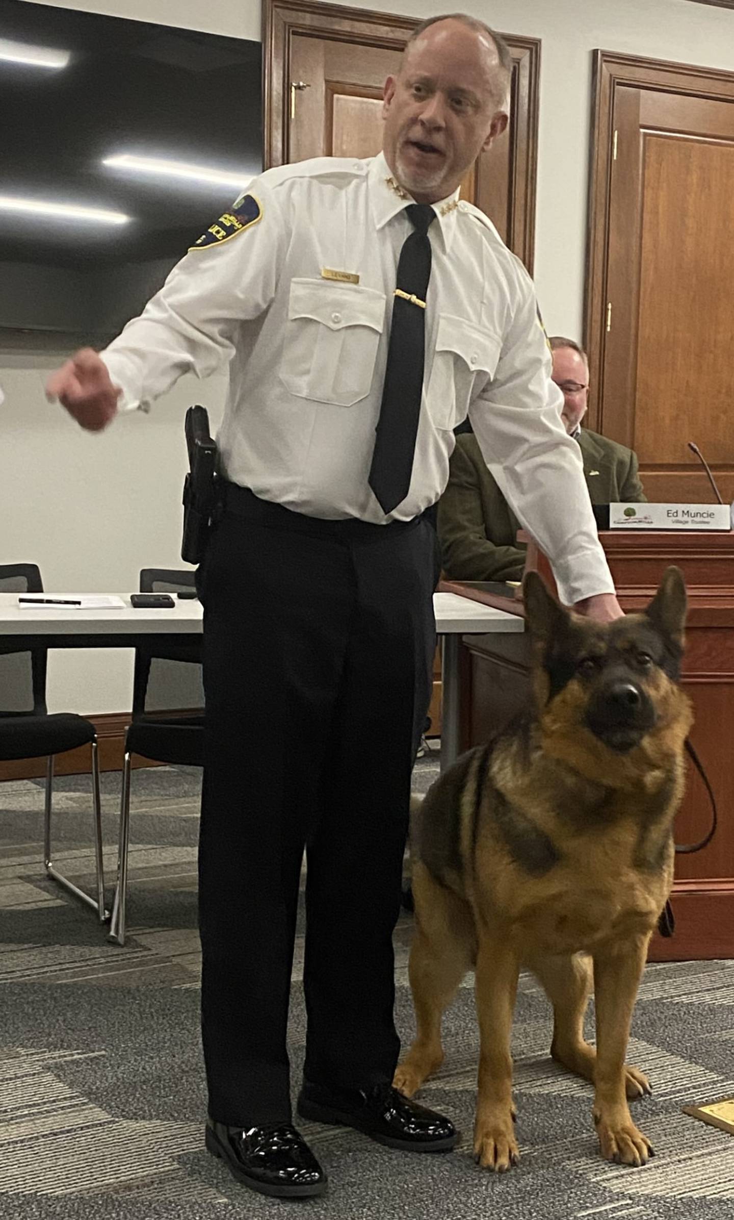 Campton Hills Police Chief James Levand and K-9 Koda at the Feb. 20, 2024 Village Board meeting where he was sworn in. Levand had served as interim chief since July.