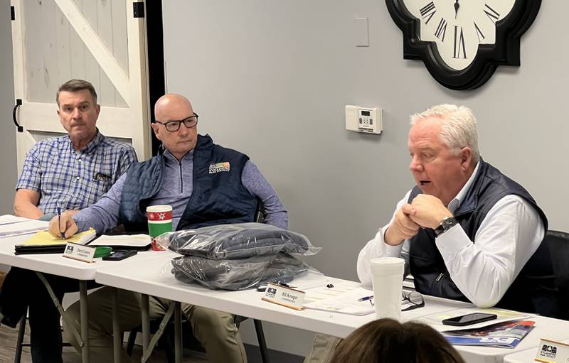 Sycamore Park District Commissioners Ted Strack and Daryl Graves listen as Bill Kroeger, president of the Sycamore Board of Commissioners, responds to residents inquiring about the community pool that was permanently closed in 2022.