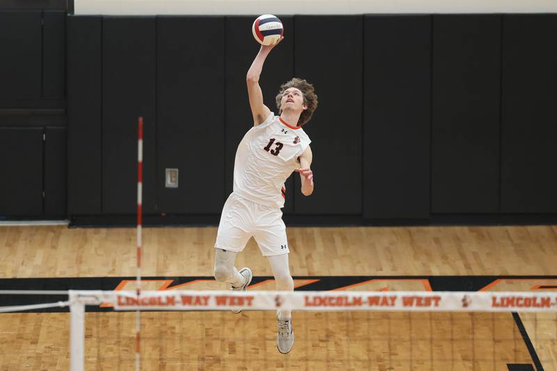 Lincoln-Way West’s Hunter Vedder serves the ball against Plainfield North on Monday, March 18, 2024 in New Lenox.