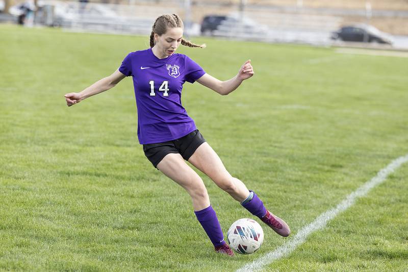 Dixon’s Maggie Van Sickle plays the ball against Rock Island battle for the ball Friday, April 12, 2024 in Dixon.