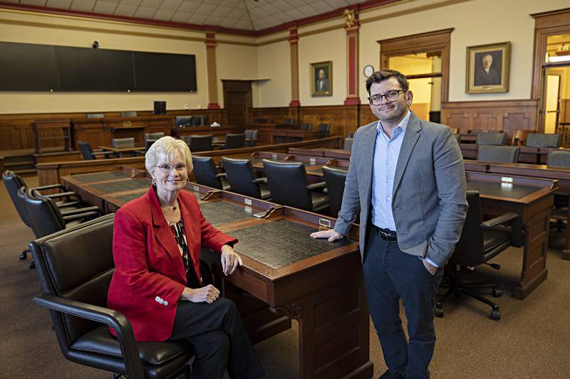 Outgoing Lee County Administrator Wendy Ryerson welcomes Jeremy Englund to the position.