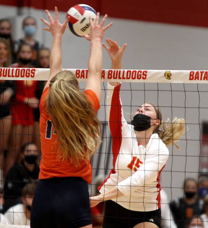 Batavia's Madelyn Hooper (15) gets the ball over the net during a 25-16, 25-18 loss to Naperville North at Batavia on Thursday, Sept. 9, 2021.