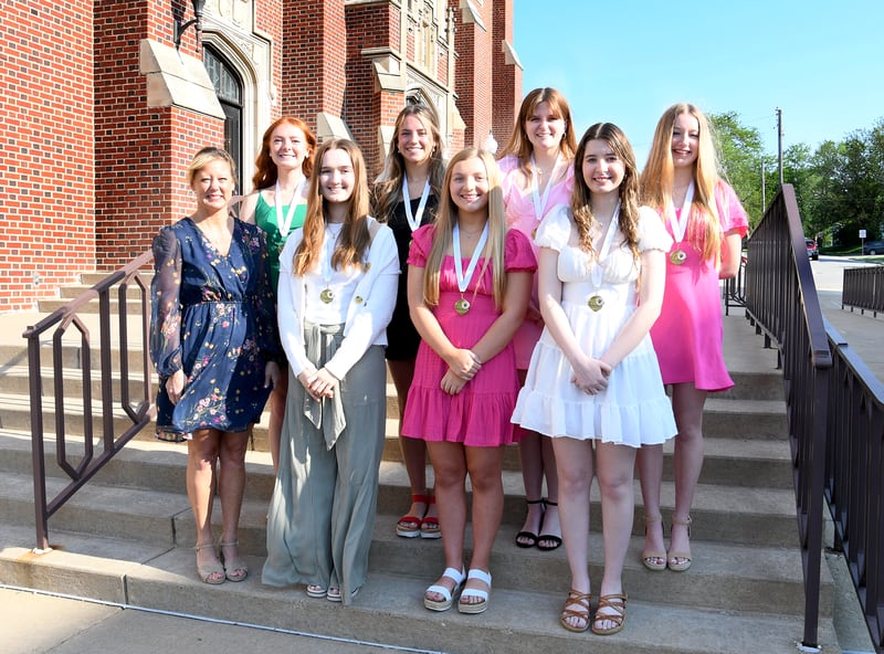 The 2024 La Salle-Peru High School Wagenknecht Scholarship recipients are Faith Arkins (front row, from second to left), Bridgit Hoskins, Natalie Perra, Addison Duttlinger (back row, from left), Isabelle Andrews, Eleanor Radtke, and Hailey Dzik. The scholarships were presented by Tammy Humpage (front row, left) of Hometown National Bank.