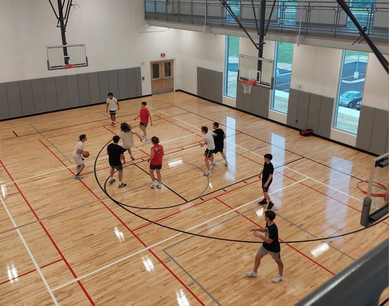 Basketball players took part in a full court pickup game Monday, May 13, 2024, on the opening day of the YMCA being open to the public in the new gymnasium.