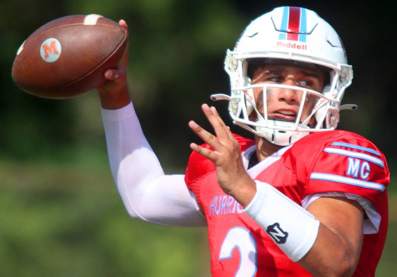 Marian Central’s Picasso Ruiz fires a pass against Bishop McNamara in varsity football action on Saturday, Sept. 14, 2024, at George Harding Field on the campus of Marian Central High School in Woodstock.