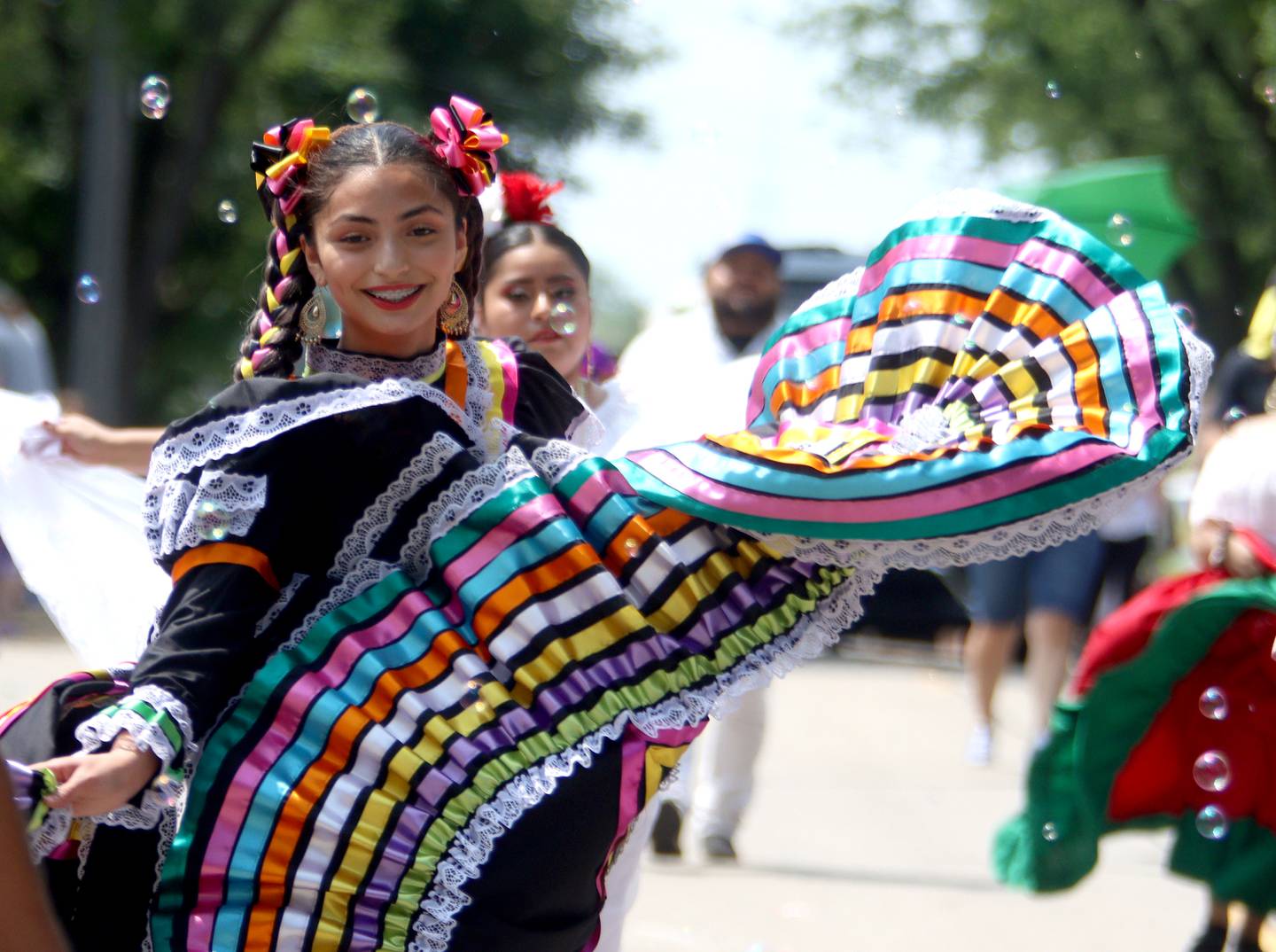 A performer from Academia de Danza Aztlan dances during the McHenry Fiesta Days Parade along Main Street on Sunday.