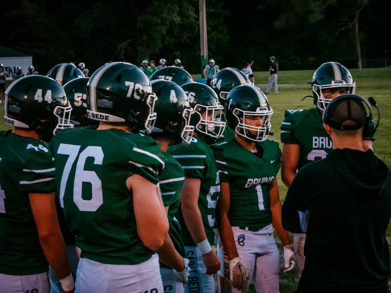 St. Bede’s football team huddles during timeout in the first quarter on Friday, September 6, 2024 at St. Bede in Peru.