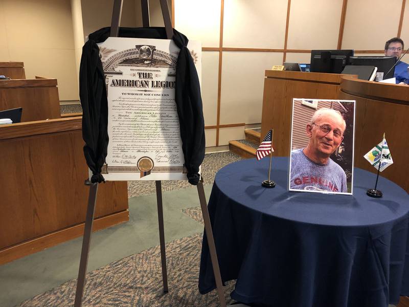 The original Woodstock American Legion charter draped in memory of Joe Kersten at the McHenry County Board room Dec. 19, 2023