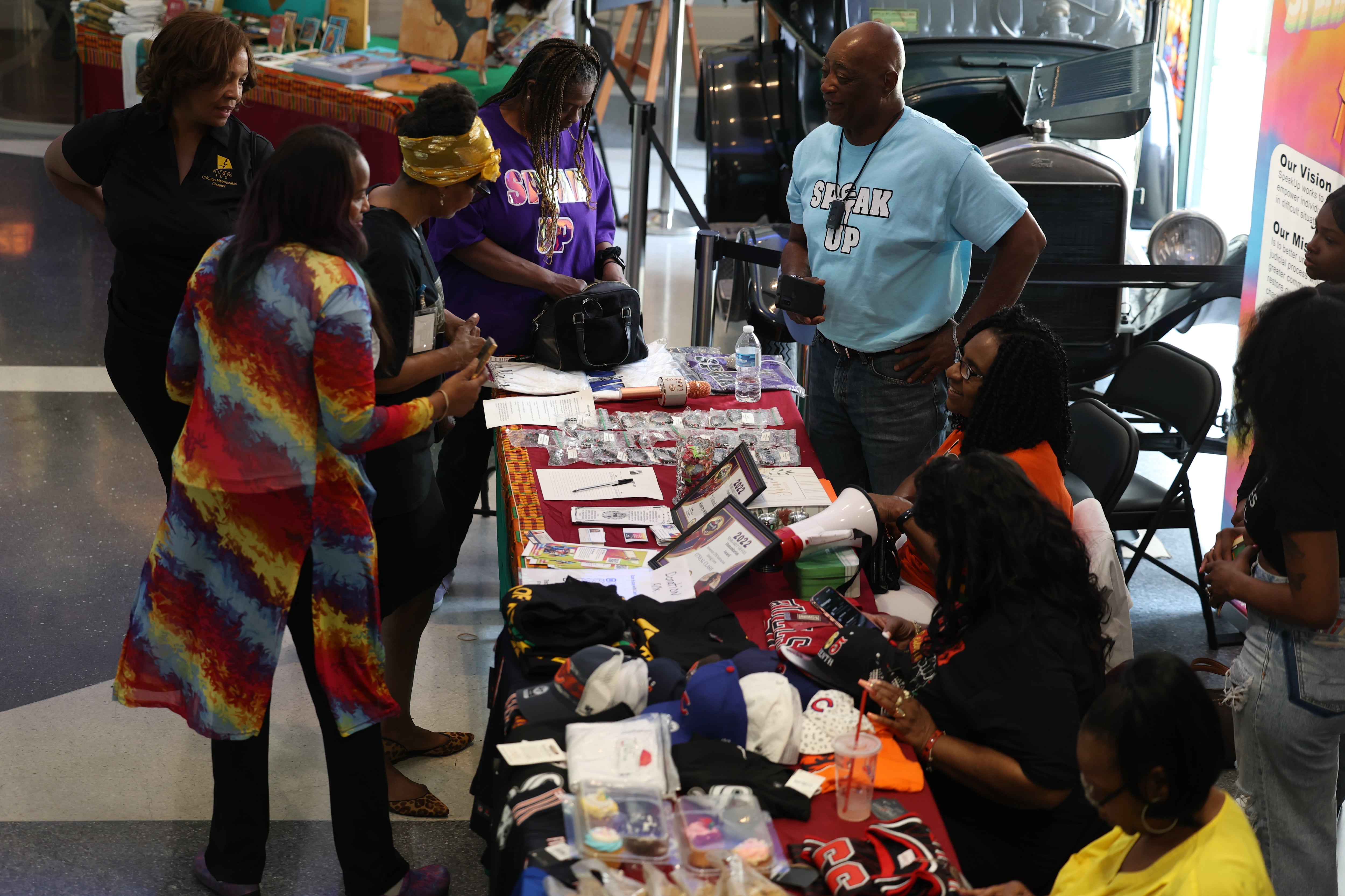 People shop at one of the black-owned business tables at the Juneteenth event hosted by the Joliet Area Historical Museum on Monday, June 19, 2023 in Joliet.