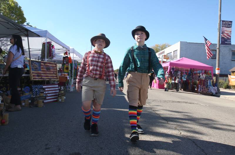 Gus Maier and Owen Stash of Peru, dress as munchkins from the "Wizard of Oz" during the Oglesby Harvest Fest on Saturday Oct. 19, 2024 in Oglesby.