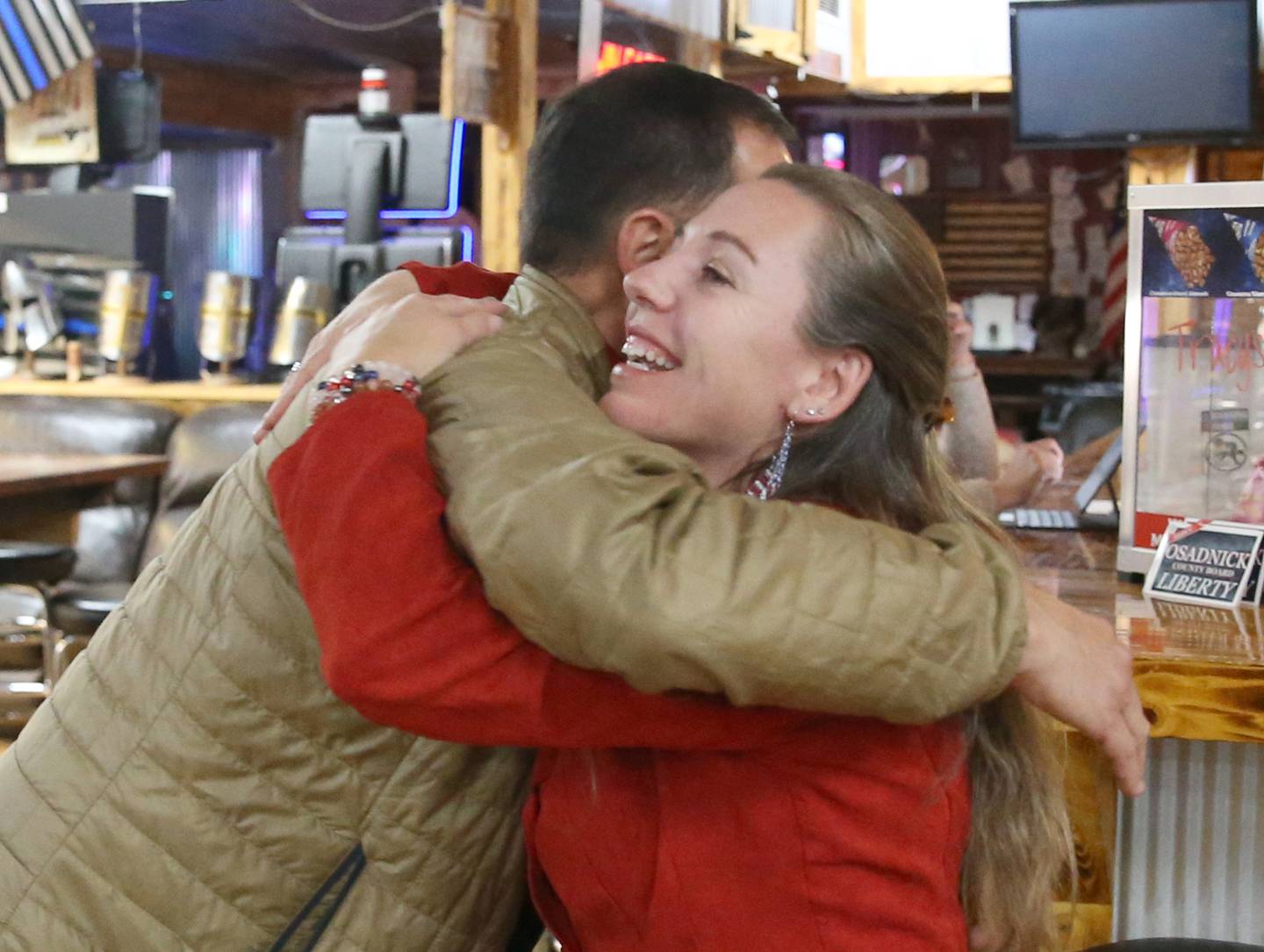 Jennifer Ebner smiles while hugging Ray Gatza receiving the news that she will be the next La Salle County Clerk on Tuesday, Nov. 8, 2022 at Jamies Outpost in Utica.