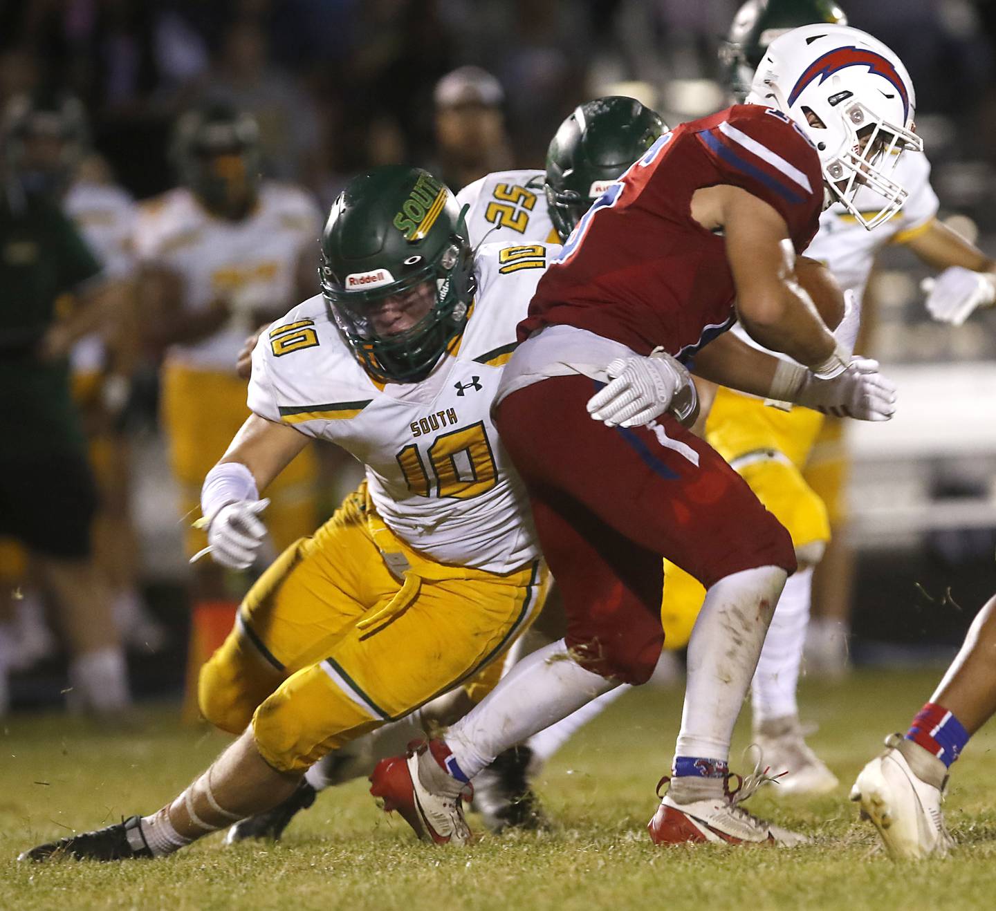 Crystal Lake South's Giovan Evers tackles Dundee-Crown's Tristan Gatenby during a Fox Valley Conference football game on Friday, Aug 30, 2024, at Dundee-Crown High School in Carpentersville.