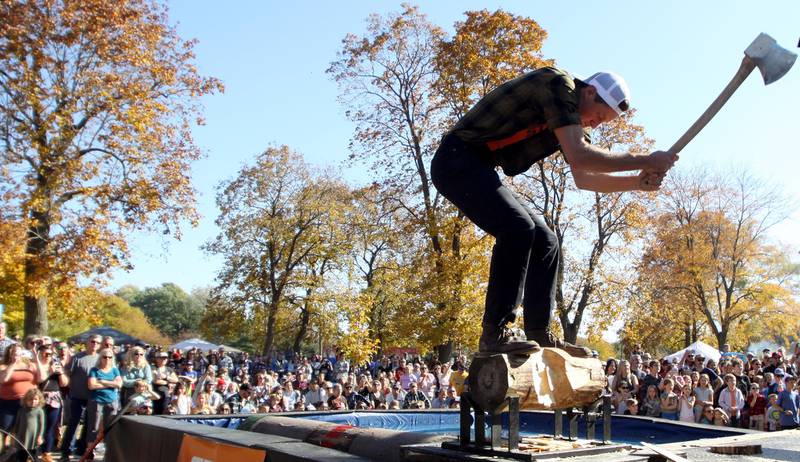 Cameron Pilgreen of Watertown, Wisconsin participates in the Timberworks Lumberjack Show during the inaugural Flannel Fest at Crystal Lake’s Main Beach on Saturday.