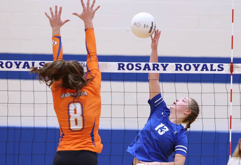 Rosary's Jessica Hirner  tries to tip the ball past Genoa-Kingston's Alivia Keegan during their Regional semifinal match Tuesday, Oct. 25, 2022, at Rosary High School in Aurora.