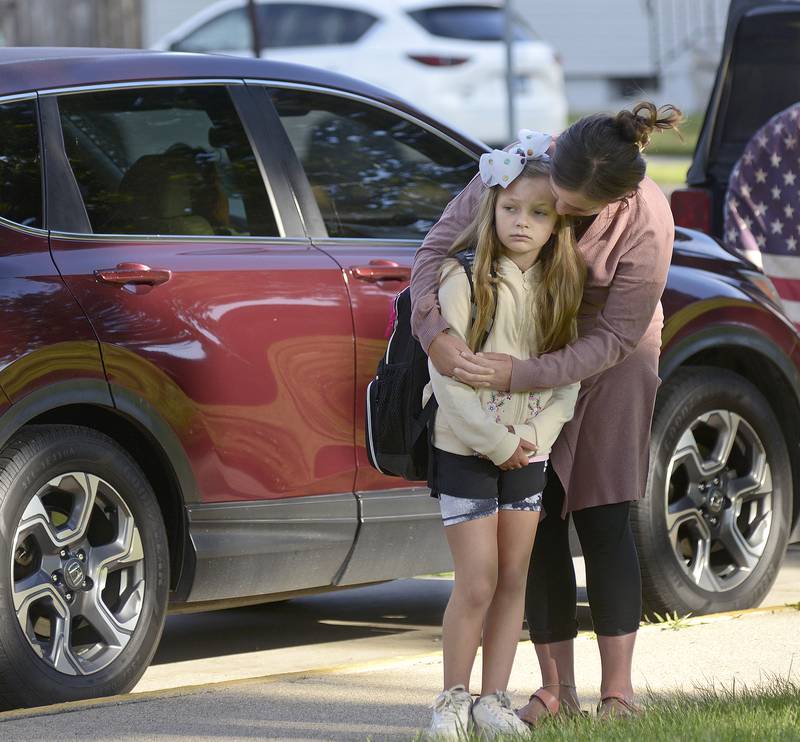 A nervous Lilianna Goetsch is calmed by her mother Cheyenne as she says goodbye on the first day of school Wednesday, Aug. 21, 2024, at McKinley School in Ottawa.