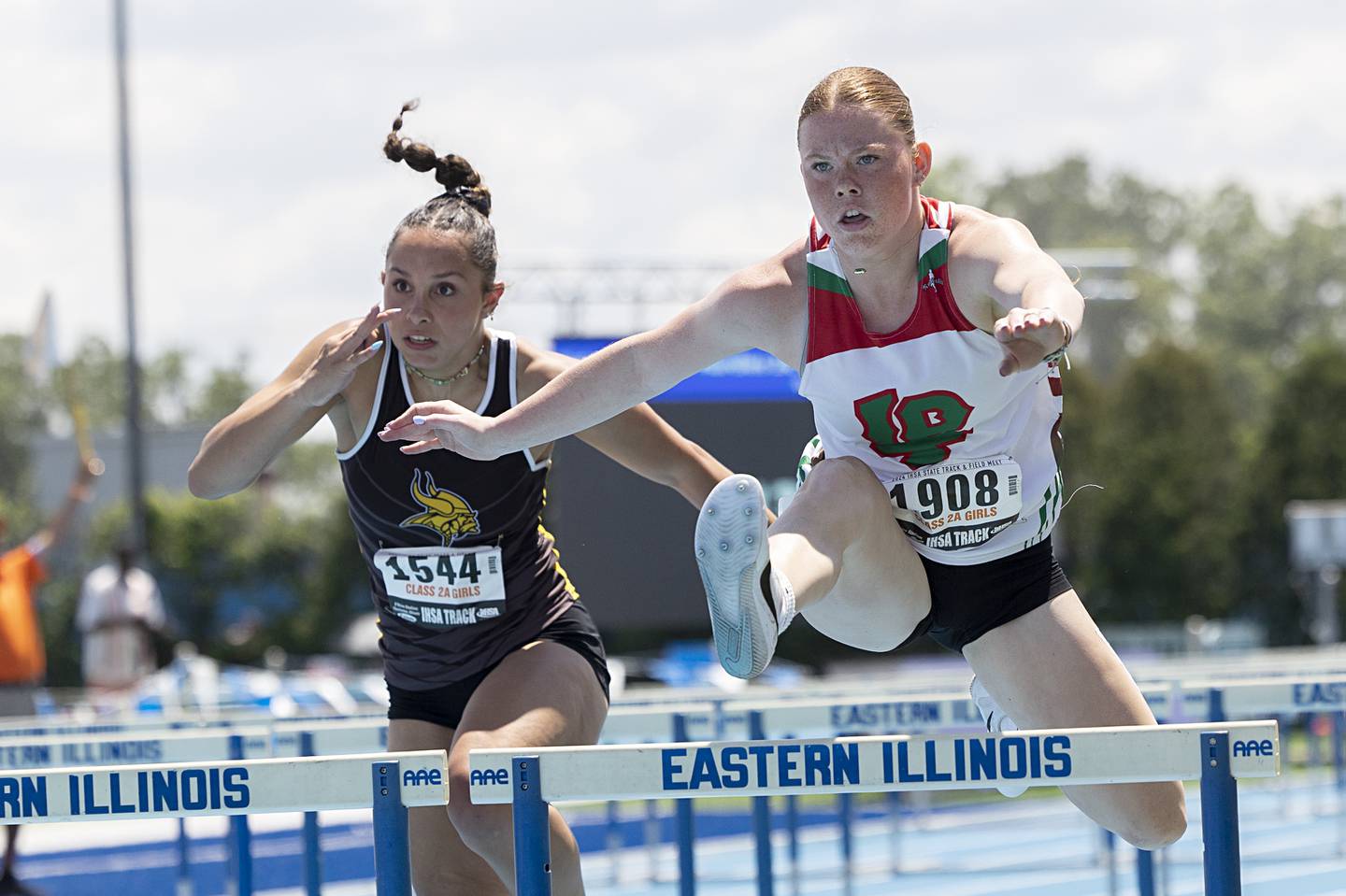 Lasalle-Peru’s Elli Sines clears the final hurdle in the 2A 100 Hurdles race Saturday in May at the IHSA girls state track meet in Charleston.