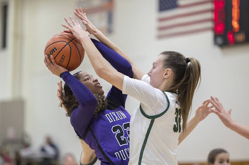 Dixon’s Ahmyrie McGowan puts up a shot against Boylan’s Lily Esparza Friday, Feb. 16, 2024 at the class 3A Rochelle girls basketball regional.