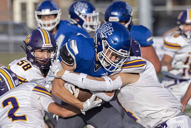 Newman’s Brady Williamson fights for yards against Sherrard Saturday, Sept. 2, 2023 in a game at Sterling High School.