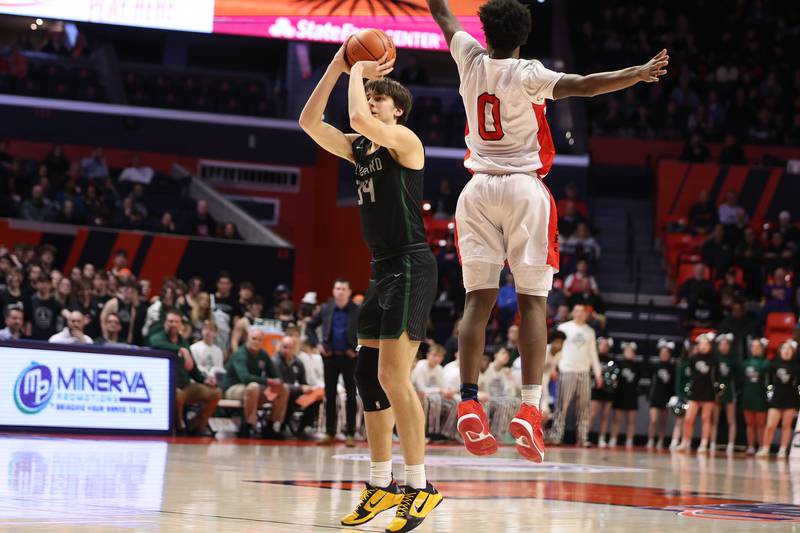 Glenbard West’s Braden Huff takes a shot against Bolingbrook in the Class 4A semifinal at State Farm Center in Champaign. Friday, Mar. 11, 2022, in Champaign.