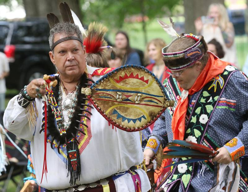 David Ranlett, of Park Forest, a member of the Blackfeet Tribe, and David Ray Armstrong, of Minneapolis, Minn., an Eastern Band Cherokee descendant, walk in the Grand Entry during the 30th Annual Potawatami Trails Pow-Wow at Shiloh Park on Saturday, August 26th in Zion. 
Photo by Candace H. Johnson for Shaw Local News Network