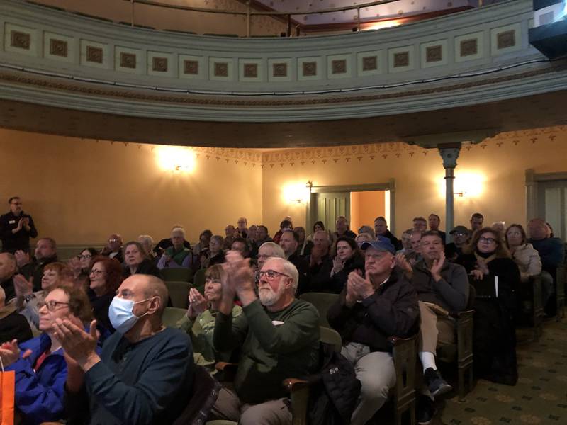 Attendees clap April 2, 2024 at the Woodstock City Council meeting.