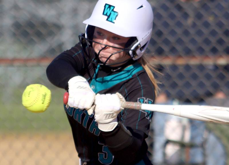 Woodstock North’s Aly Jordan makes contact in varsity softball at Crystal Lake Central Friday.