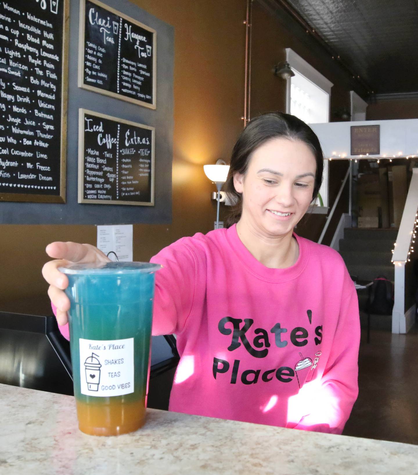 Kate Huftalin, owner of Kate's Place, serves up a boosted tea Wednesday, Jan. 19, 2022, at the nutrition and wellness beverage shop located at 114 S. California St. in Sycamore. Kate's Place, along with many other restaurants in Sycamore, will be participating in Sycamore's Eat Week Jan. 24 through Jan. 31.